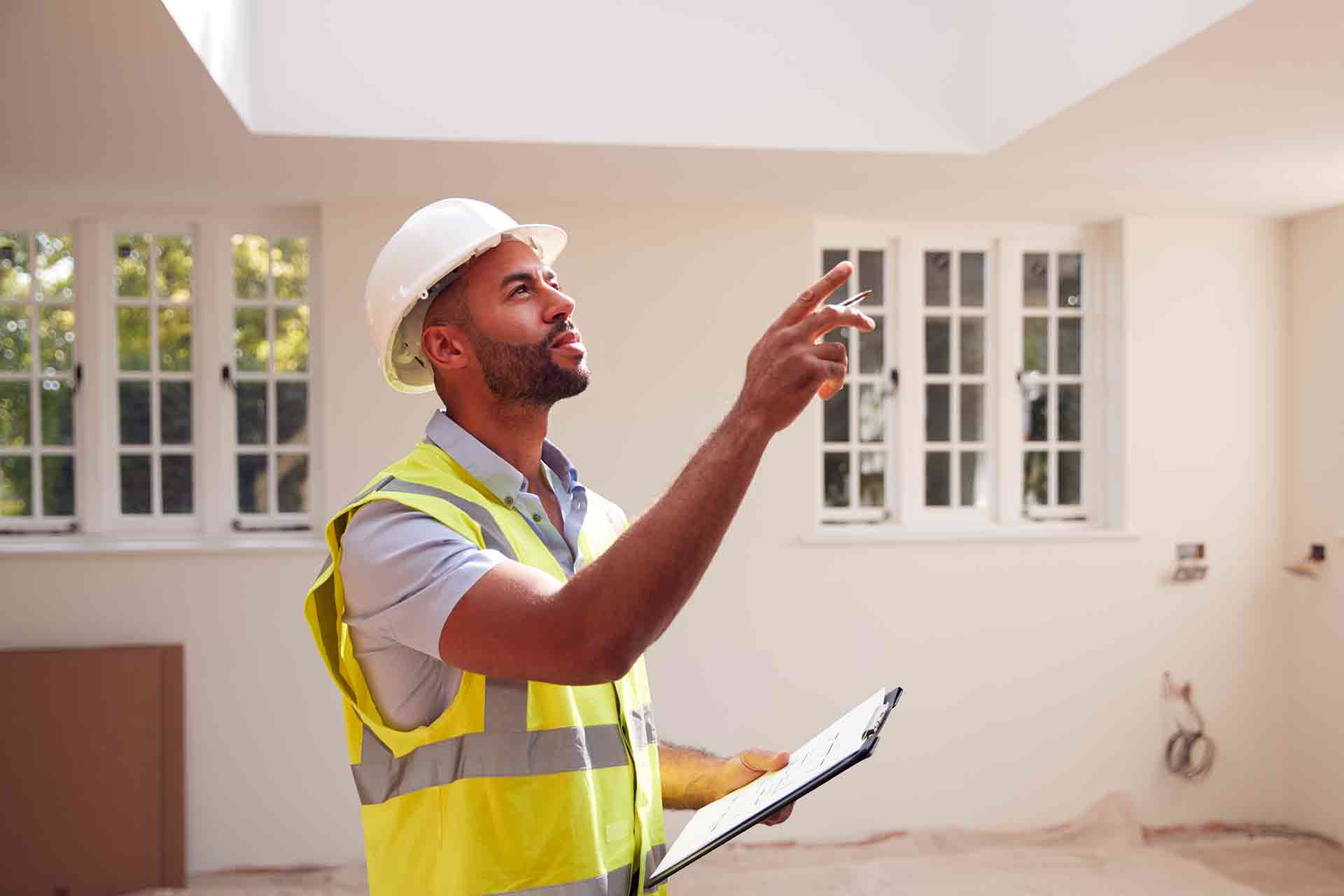 Third Party Wall Surveyors Nottingham reviewing plans between two parties during a dispute